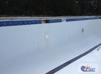 Clean swimming pool surface after pressure washing