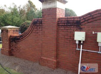 Dirty brick wall before pressure washing