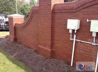 Clean brick wall after pressure washing