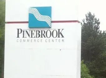 Clean Pinebrook Commerce Center sign after pressure washing