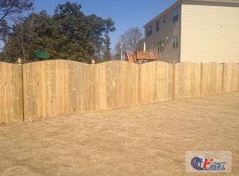 Clean wooden fence after pressure washing