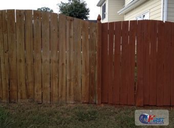 Clean wooden fence after pressure washing