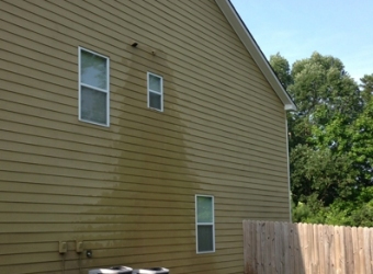 Clean vinyl house siding after pressure washing