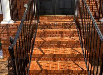 Clean brick front steps after pressure washing