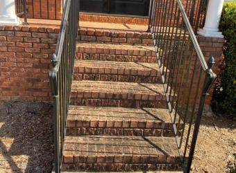 Brick front steps before pressure washing