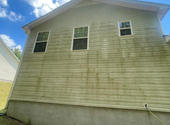 House siding before pressure washing