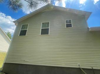 Clean house siding after pressure washing