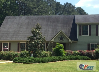 Stained shingle roof before roof cleaning