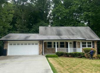Stained shingle roof before roof cleaning
