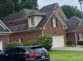 Stained shingle roof before roof cleaning