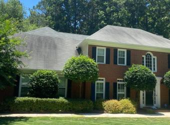 Stained shingle roof before roof cleaning